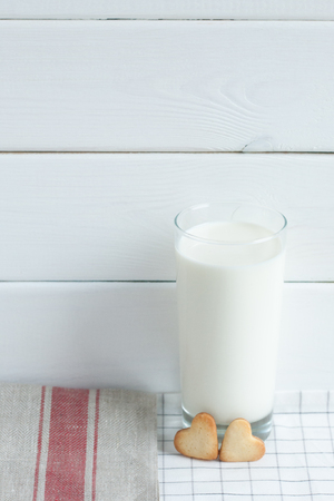 Cookies in the form of hearts with milk.の写真素材