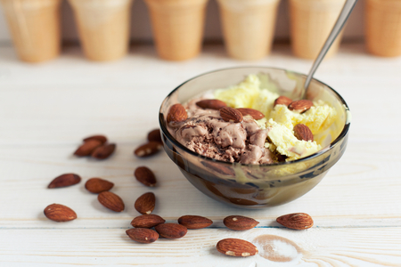 Melon and Chocolate ice cream with almonds in the background waffle cups.の写真素材