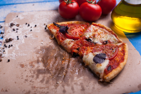 rustic italian pizza with mozzarella, cheese and basil leaves. vegetarian foodの写真素材