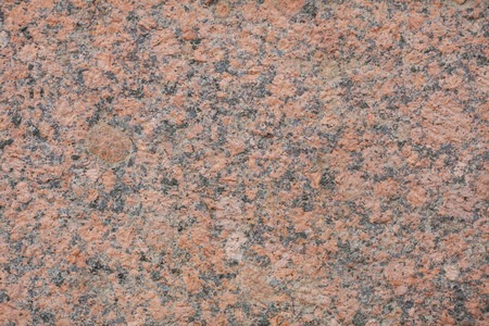 red granite wall as a texture background.