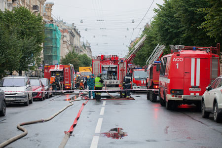 Saint Petersburg, Russia, on the morning of September 13, 2017. Firefighters extinguish a large fire on the roof of a residential house on the street Tchaikovsky 31のeditorial素材