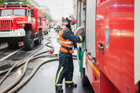 Saint Petersburg, Russia, on the morning of September 13, 2017. Firefighters extinguish a large fire on the roof of a residential house on the street Tchaikovsky 31のeditorial素材
