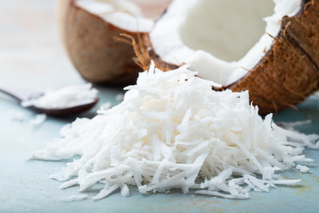 Fresh coconut flakes on a blue backgroundの写真素材