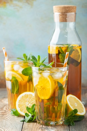 Iced tea with lemon and ice in tall glasses.の写真素材