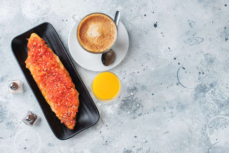 Traditional Spanish breakfast. Tostada with different toppings on a light background. Top view with copy spaceの写真素材