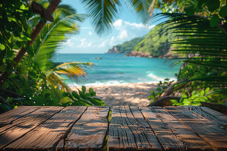 Empty wood table over blue sea, beach and palm leaves background in summer day. Background with copy...