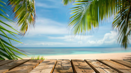Empty wood table over blue sea, beach and palm leaves background in summer day. Background with copy space for product display.の写真素材