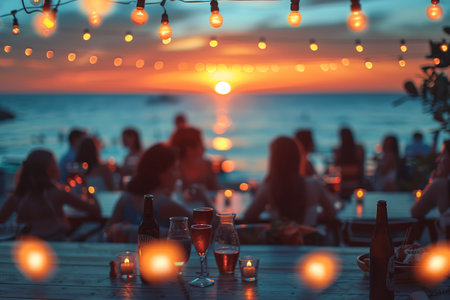 blur people picnic in a public Park with family or friends. the food festival at night.の素材