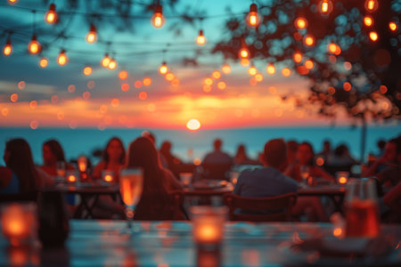 blur people picnic in a public Park with family or friends. the food festival at night.の素材