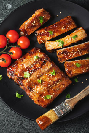 Grilled spare ribs served on a plate with sauce. Top view. Copy space.の写真素材