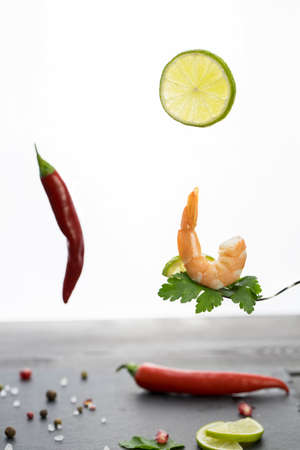 shrimp on a fork, place for your text, isolated on white backgroundの写真素材