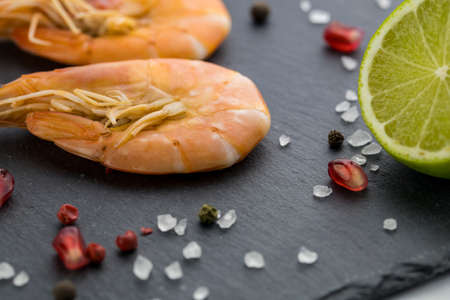 Large shrimp with lemon. Top view. Free space for your text. On the white background.の写真素材
