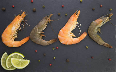 Shrimp with lime on a stone plate, sprinkledの写真素材