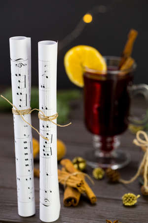 musical notes against the background of a burning christmas drink.の写真素材