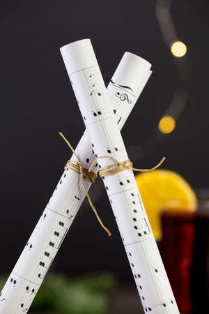 musical notes against the background of a burning christmas drink.の写真素材