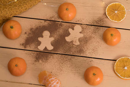 tangerines on the table with cinnamon.の写真素材