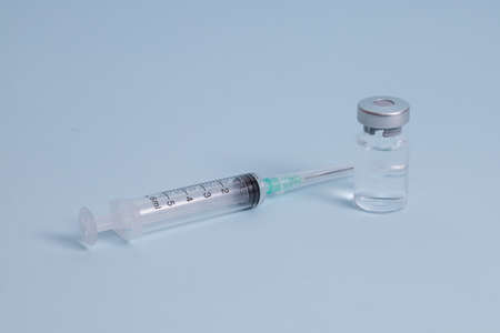COVID vaccine, Coronavirus vaccine difference dose and size with needle, prepare for injection, medical vaccine on a blude background.の写真素材