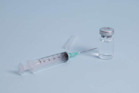 COVID vaccine, Coronavirus vaccine difference dose and size with needle, prepare for injection, medical vaccine on a blude background.の写真素材