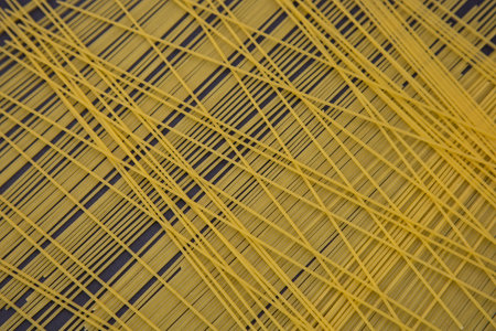 top view of raw Italian spaghetti isolated on black, panoramic shot.の写真素材