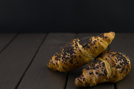 tasty croissants with chocolate on wooden backgroundの写真素材
