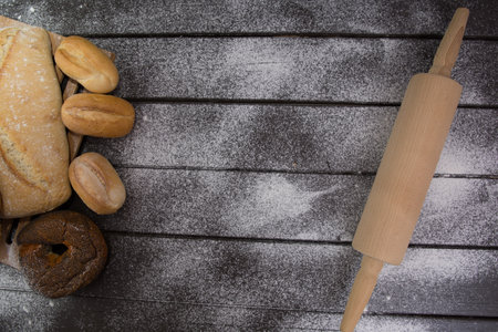 Homemade crusty bread cooking on blackboard background. Top view with space for your textの写真素材