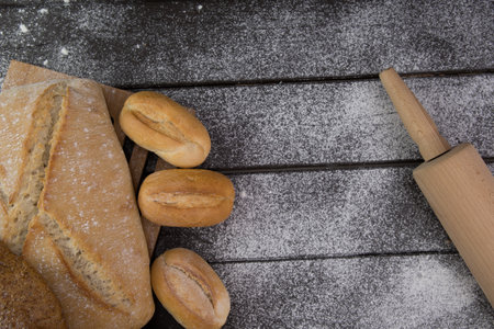 Homemade crusty bread cooking on blackboard background. Top view with space for your textの写真素材