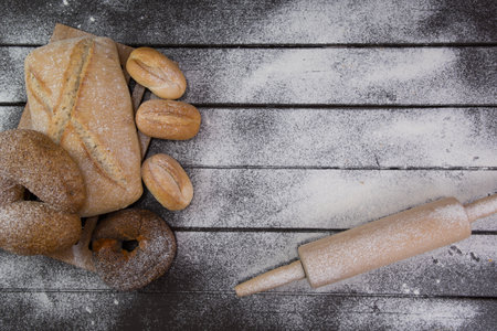 Homemade crusty bread cooking on blackboard background. Top view with space for your textの写真素材