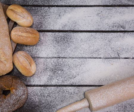 Homemade crusty bread cooking on blackboard background. Top view with space for your textの写真素材