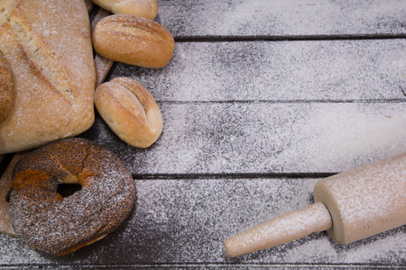 Homemade crusty bread cooking on blackboard background. Top view with space for your textの写真素材