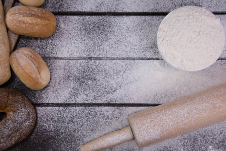 Homemade crusty bread cooking on blackboard background. Top view with space for your textの写真素材