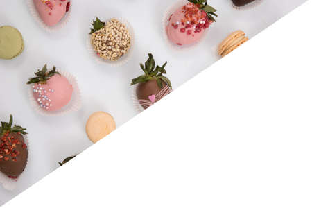 Assorted strawberries in chocolate, sweet dessert, berries in different chocolate and sprinkled with nuts.の写真素材