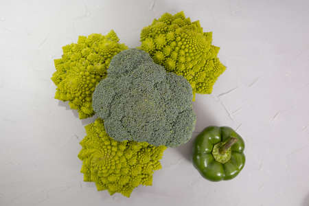 Healthy vegetarian food, fresh green food romanesco broccoli, pepper, zucchini and avocado (Green)の写真素材