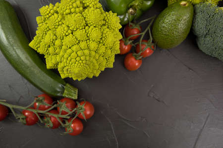 Healthy vegetarian food, fresh green food romanesco broccoli, pepper, zucchini and avocado (Green)の写真素材