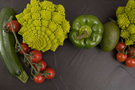 Healthy vegetarian food, fresh green food romanesco broccoli, pepper, zucchini and avocado (Green)の写真素材