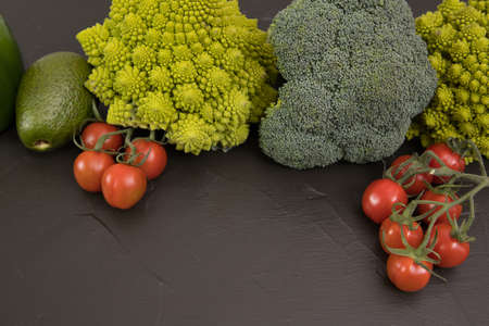 Healthy vegetarian food, fresh green food romanesco broccoli, pepper, zucchini and avocado (Green)の写真素材