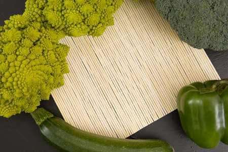 Healthy vegetarian food, fresh green food romanesco broccoli, pepper, zucchini and avocado (Green)の写真素材