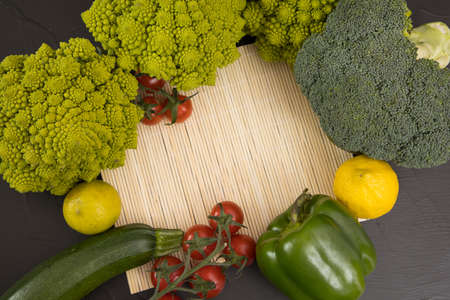 Healthy vegetarian food, fresh green food romanesco broccoli, pepper, zucchini and avocado (Green)の写真素材