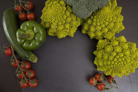 Healthy vegetarian food, fresh green food romanesco broccoli, pepper, zucchini and avocado (Green)の写真素材