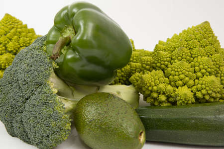 Healthy vegetarian food, fresh green food, green vegetable, romanesco broccoli, pepper, zucchini and avocado on a isolated (Green vegetable)の写真素材
