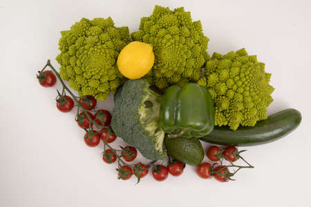 Healthy vegetarian food, fresh green food, green vegetable, romanesco broccoli, pepper, zucchini and avocado on a isolated (Green vegetable)の写真素材