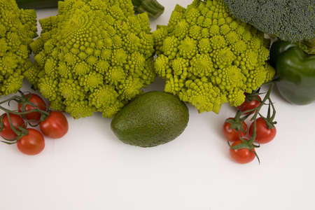 Healthy vegetarian food, fresh green food, green vegetable, romanesco broccoli, pepper, zucchini and avocado on a isolated (Green vegetable)の写真素材