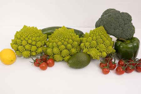 Healthy vegetarian food, fresh green food, green vegetable, romanesco broccoli, pepper, zucchini and avocado on a isolated (Green vegetable)の写真素材