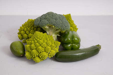 Healthy vegetarian food, fresh green food, green vegetable, romanesco broccoli, pepper, zucchini and avocado.の写真素材