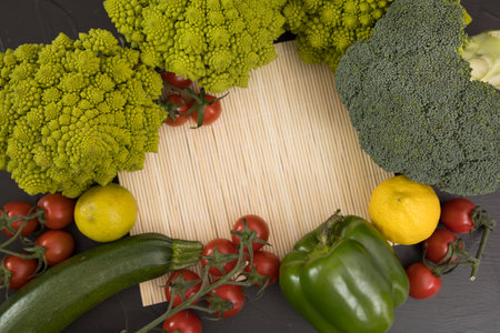 fresh vegetable, romanesco broccoli, pepper, zucchini, avocado, lemon and cherry tomato, free space in your text.の写真素材