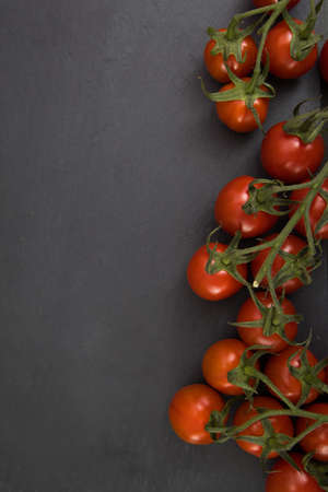 Healthy vegetarian food, cherry tomato, free space in your text on a stone plate.の写真素材