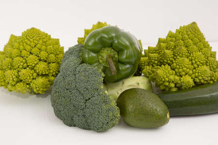 fresh green food, green vegetable, romanesco broccoli, pepper, zucchini and avocado on a isolated Background.の写真素材