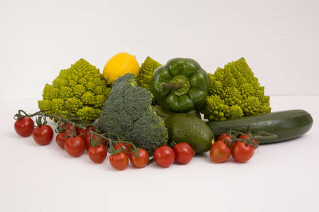 fresh vegetable, romanesco, pepper, zucchini, avocado, cherry tomato and lemon free space in your text, on a isolated background.の写真素材