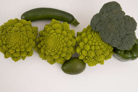 fresh green vegetable, romanesco broccoli, pepper, zucchini, avocado, free space in your text, on a isolated background.の写真素材