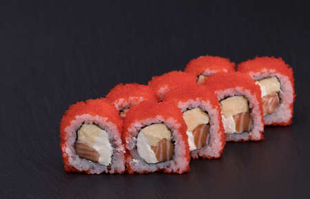 Sushi Rolls Sake Tomago Maki with RICE, SALMON, JAPANESE OMLET, CREAM CHEESE and MASAGO.の写真素材