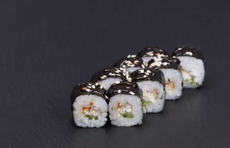Sushi Rolls Unagi Maki with Rice, cucumber, EEL, SESAME AND TERIJAKI sauce.の写真素材
